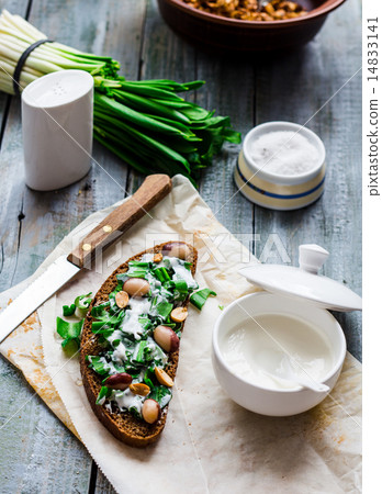 bread with wild garlic, sour cream and quail eggs 14833141