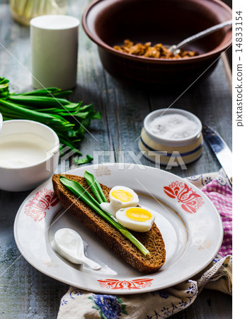bread with wild garlic, sour cream and quail eggs bread with wild garlic, sour cream and quail eggs 14833154