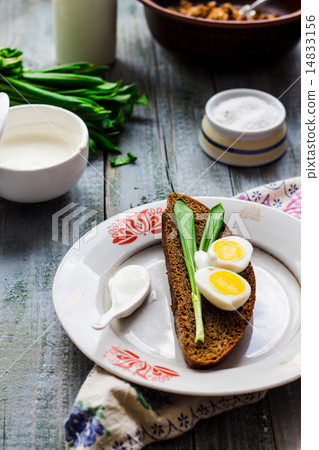bread with wild garlic, sour cream and quail eggs bread with wild garlic, sour cream and quail eggs 14833156