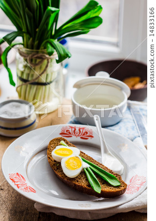 bread with wild garlic, sour cream and quail eggs 14833166