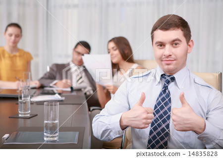 Businessman shows thumbs up 14835828