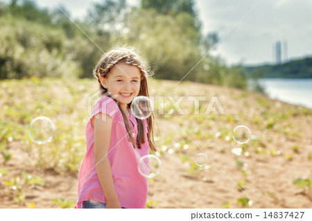 Beautiful little girl having fun in park 14837427