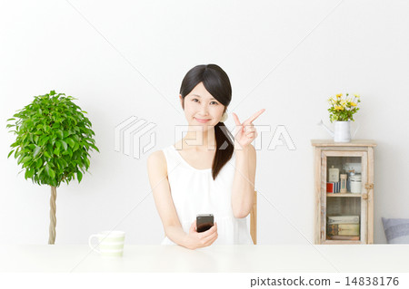 A woman to check sign with a smartphone 14838176