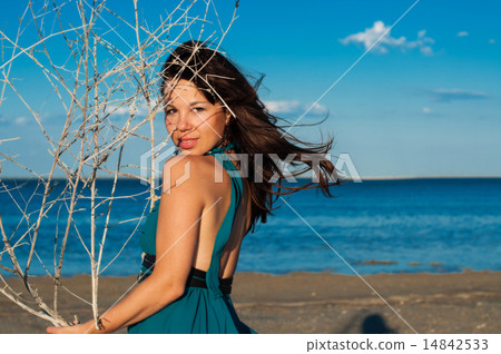 Young woman at the beach in beautiful dress Young woman at the beach in beautiful dress 14842533