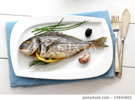 Garnished grilled whole sea bream with olives 14842662