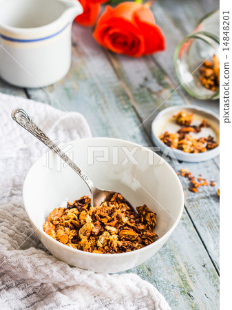 granola with nuts and dried fruits, flowers 14848201