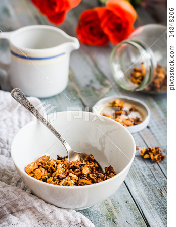 granola with nuts and dried fruits, flowers 14848206
