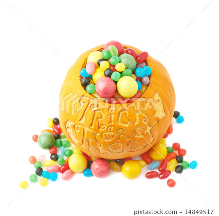 Trick or treat pumpkin filled with candy sweets Trick or treat pumpkin filled with candy sweets 14849517