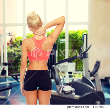 sporty woman touching her neck sporty woman touching her neck 14870890