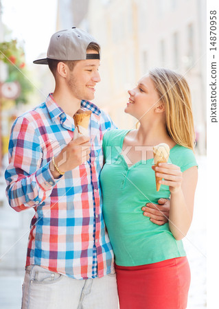 smiling couple with ice-cream in city smiling couple with ice-cream in city 14870958