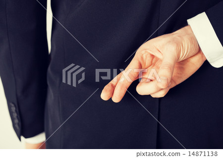 man with crossed fingers man with crossed fingers 14871138