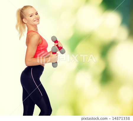 smiling beautiful sporty woman with dumbbells smiling beautiful sporty woman with dumbbells 14871338