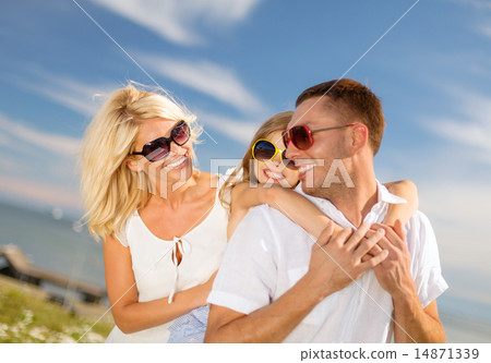 happy family in sunglasses having fun outdoors happy family in sunglasses having fun outdoors 14871339