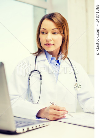 busy doctor with laptop computer and clipboard busy doctor with laptop computer and clipboard 14871369
