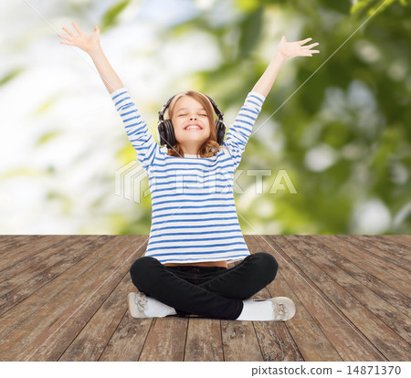 happy girl with headphones listening to music happy girl with headphones listening to music 14871370