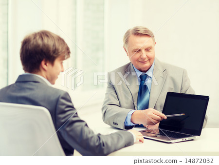 older man and young man with laptop computer older man and young man with laptop computer 14872032