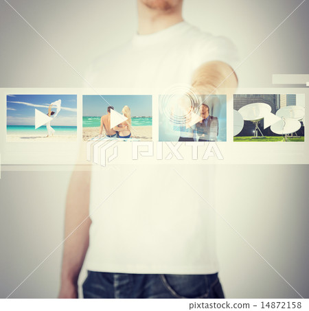 man pressing button on virtual screen man pressing button on virtual screen 14872158