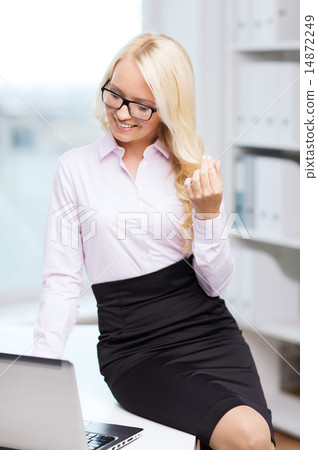 smiling businesswoman or student with laptop smiling businesswoman or student with laptop 14872249