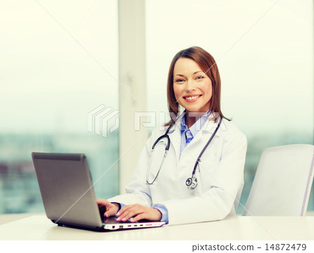 busy doctor with laptop computer busy doctor with laptop computer 14872479