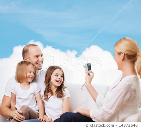 happy family with camera at home 14872640