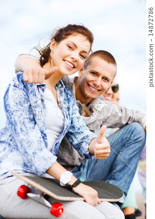teenages with skateboard outside 14872786