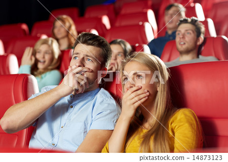 happy friends watching horror movie in theater happy friends watching horror movie in theater 14873123