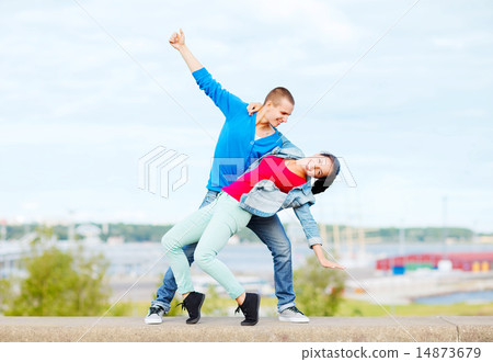 couple of teenagers dancing outside 14873679