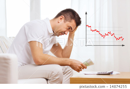 man with money and calculator at home man with money and calculator at home 14874255