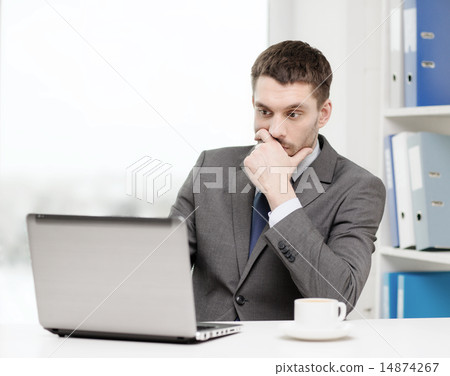 busy businessman with laptop and coffee busy businessman with laptop and coffee 14874267