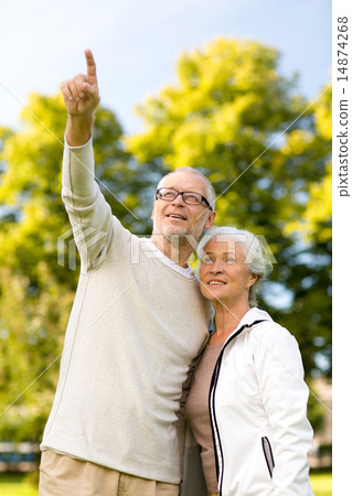 senior couple hugging in park senior couple hugging in park 14874268