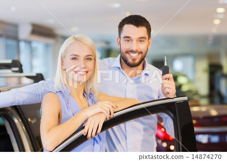 happy couple buying car in auto show or salon happy couple buying car in auto show or salon 14874270
