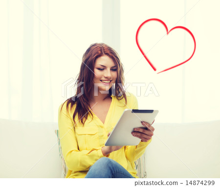 smiling woman with tablet pc computer at home 14874299