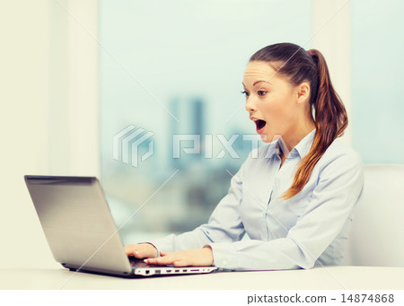 surprised businesswoman with laptop surprised businesswoman with laptop 14874868