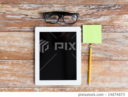 close up of tablet pc, eyeglasses and pencil close up of tablet pc, eyeglasses and pencil 14874873