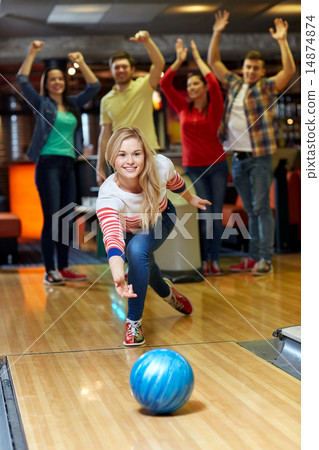 happy young woman throwing ball in bowling club happy young woman throwing ball in bowling club 14874874