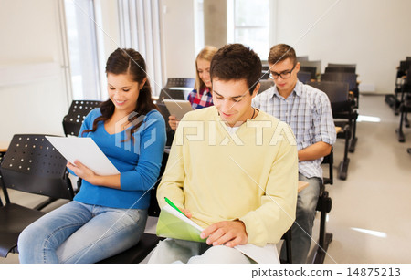 group of smiling students in lecture hall 14875213
