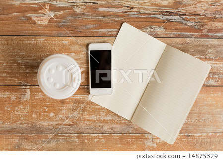 close up of notebook, coffee cup and smartphone 14875329