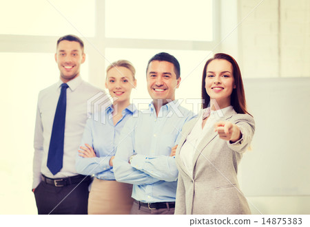 businesswoman in office pointing finger at you 14875383