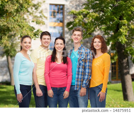 group of smiling teenagers over campus background group of smiling teenagers over campus background 14875951