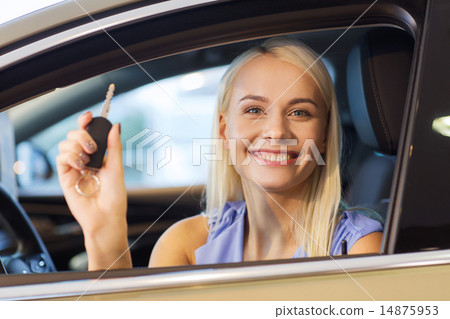 happy woman getting car key in auto show or salon happy woman getting car key in auto show or salon 14875953