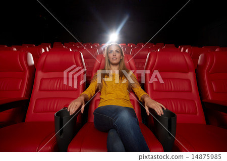 young woman watching movie in theater young woman watching movie in theater 14875985