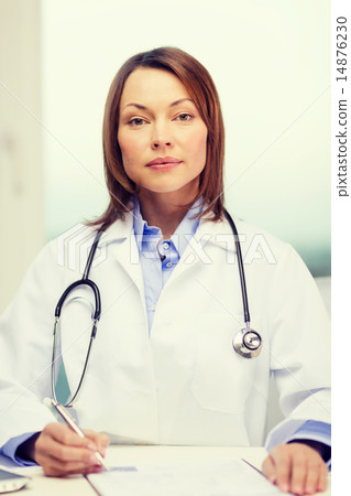 busy doctor with laptop computer and clipboard busy doctor with laptop computer and clipboard 14876230