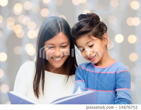 happy mother and daughter reading book happy mother and daughter reading book 14876752