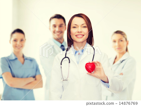 smiling female doctor with heart and stethoscope smiling female doctor with heart and stethoscope 14876769