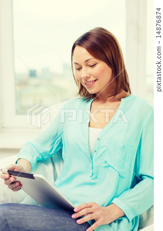 happy woman with tablet pc computer at home happy woman with tablet pc computer at home 14876874