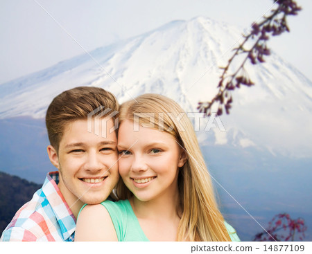 smiling couple hugging over mountains background 14877109
