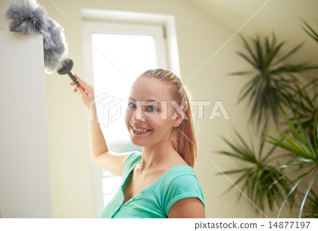 happy woman with duster cleaning at home 14877197