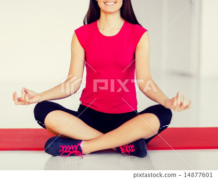 girl sitting in lotus position and meditating girl sitting in lotus position and meditating 14877601
