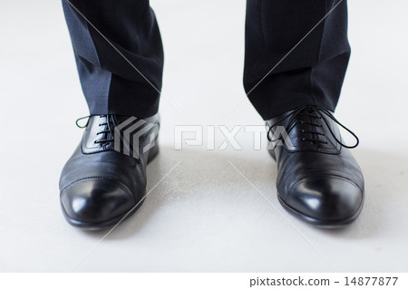 close up of man legs in elegant shoes with laces close up of man legs in elegant shoes with laces 14877877