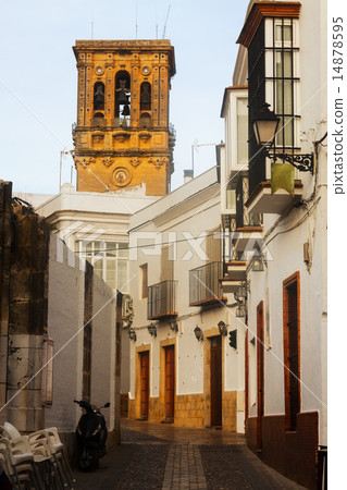 Picturesque street with bell tower. Arcos de la Frontera 14878595